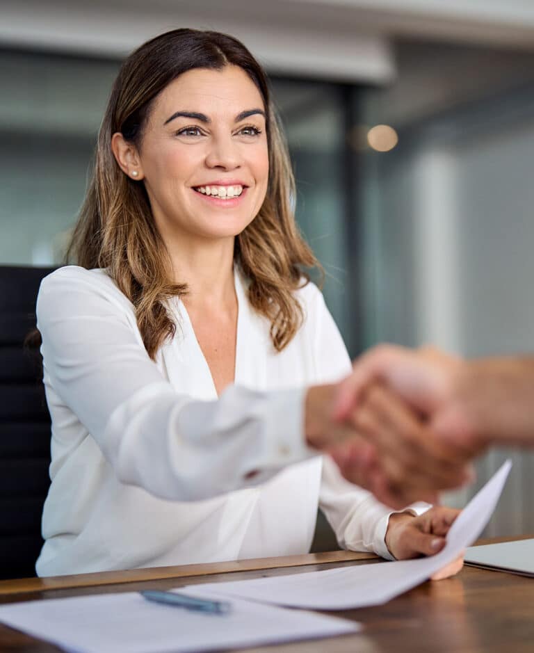 Financial woman manager handshaking at office meeting